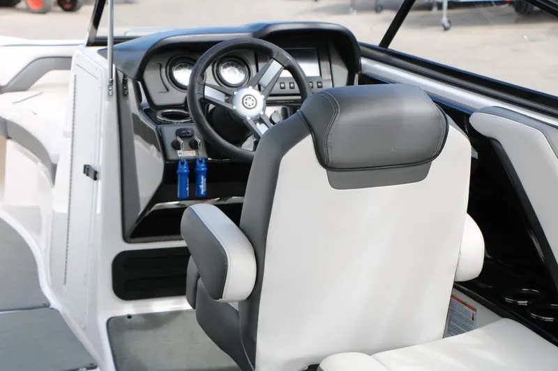 Slide: The Image of 2017 Yamaha Boats AR240 HO cockpit with steering wheel and captain's chair. - 22