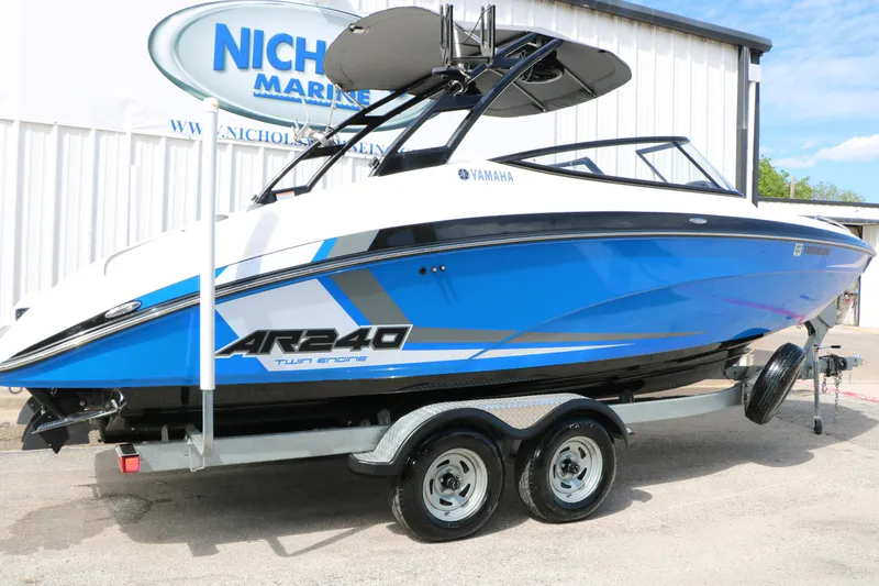 Slide: The Image of 2017 Yamaha Boats AR240 HO in blue on trailer at dealership. - 3