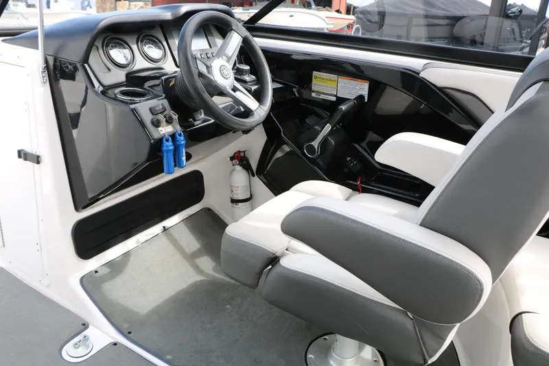 Slide: The Image of 2017 Yamaha Boats AR240 HO cockpit with steering wheel and control panel. - 30