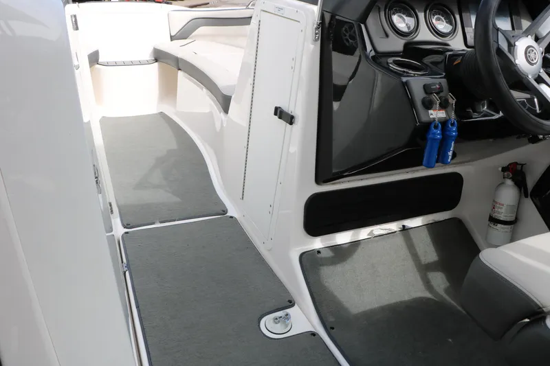 Slide: The Image of 2017 Yamaha Boats AR240 HO interior with steering wheel, gauges, and seating area. - 31
