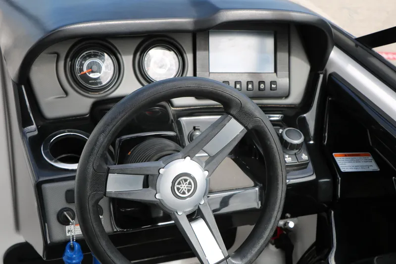 Slide: The Image of 2017 Yamaha Boats AR240 HO dashboard with steering wheel and control panel. - 32