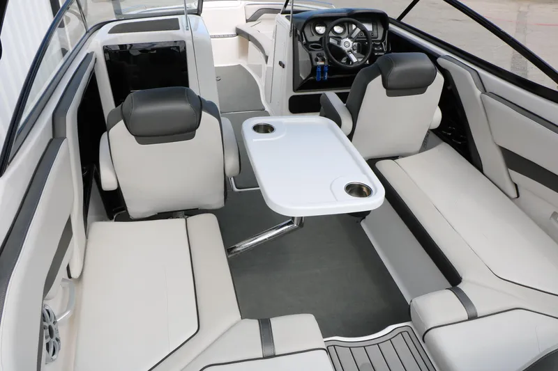 Slide: The Image of Interior of 2017 Yamaha Boats AR240 HO, featuring sleek seating and a central table. - 39