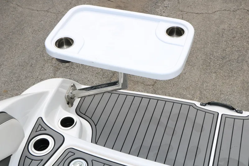 Slide: The Image of 2017 Yamaha Boats AR240 HO swim platform with mounted table and cup holders. - 41