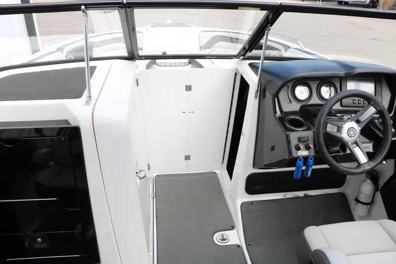 Slide: The Image of 2017 Yamaha Boats AR240 HO interior with steering wheel and dashboard controls. - 42