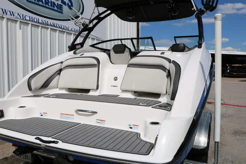 Slide: The Image of 2017 Yamaha Boats AR240 HO, rear view, showcasing seating and swim platform. - 7