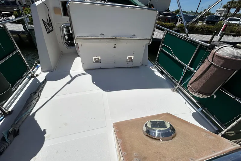 Slide: The Image of 1987 Transpacific Marine Eagle 32 Trawler deck with green rail covers and solar vent. - 16