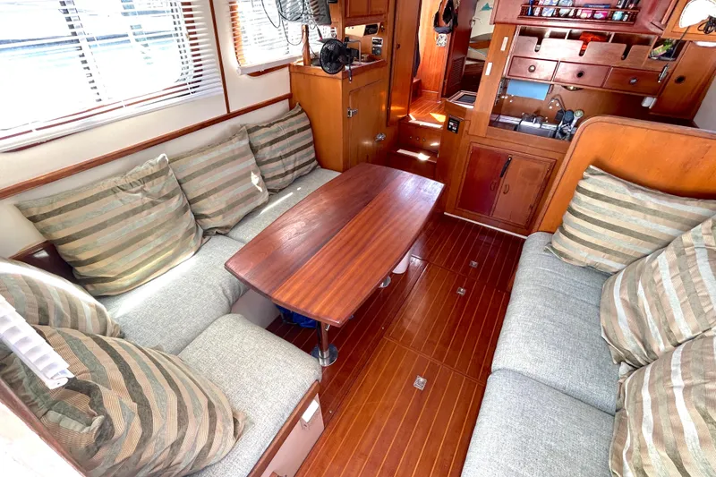 Slide: The Image of Interior of 1987 Transpacific Marine Eagle 32 Trawler with cozy seating and wooden finishes. - 22