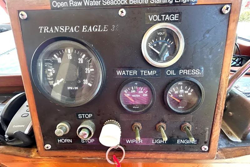 Slide: The Image of Control panel of a 1987 Transpacific Marine Eagle 32 Trawler with gauges and switches. - 37