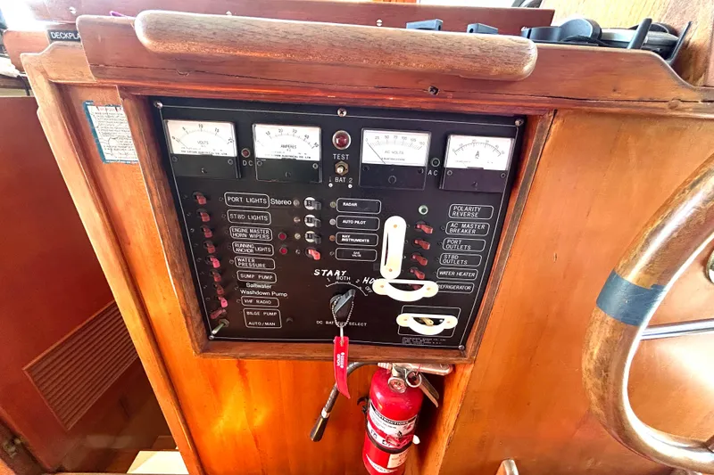 Slide: The Image of Control panel of a 1987 Transpacific Marine Eagle 32 Trawler with gauges and switches. - 38