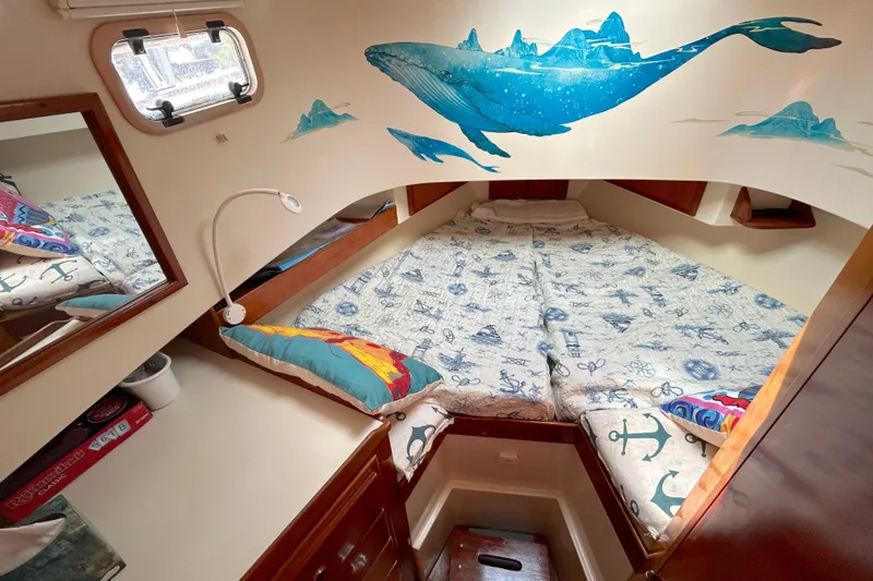 Slide: The Image of Cozy cabin interior of 1987 Transpacific Marine Eagle 32 Trawler with nautical decor. - 44