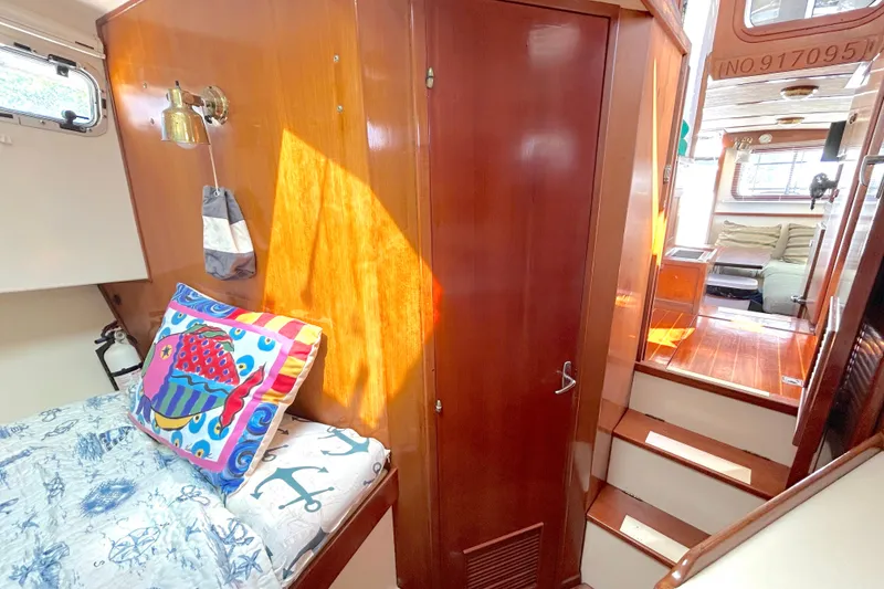 Slide: The Image of Interior of 1987 Transpacific Marine Eagle 32 Trawler with cozy cabin and vibrant decor. - 46