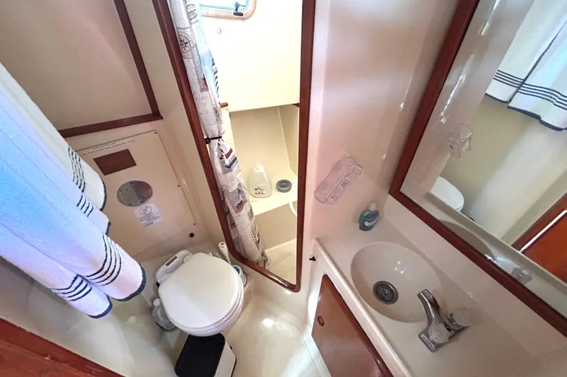 Slide: The Image of Bathroom interior of 1987 Transpacific Marine Eagle 32 Trawler with sink and toilet. - 48