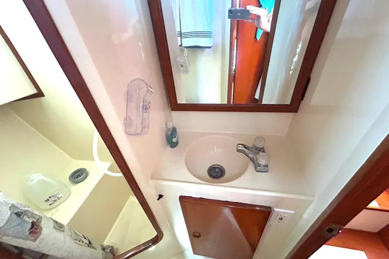 Slide: The Image of Bathroom interior of 1987 Transpacific Marine Eagle 32 Trawler with sink and mirror. - 51