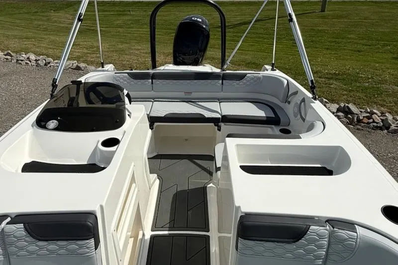Slide: The Image of 2026 Bayliner M17 boat interior with seating and steering console. - 10