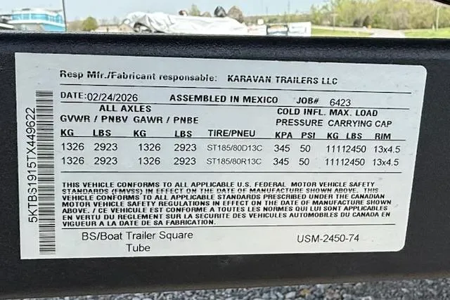 Slide: The Image of Label on a Karavan trailer, detailing specifications and compliance information. - 14