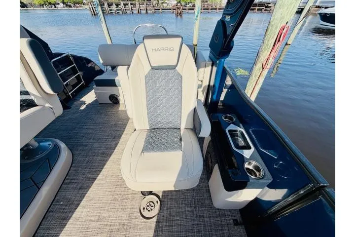 Slide: The Image of Luxury seating on 2022 Harris Grand Mariner 250 pontoon boat by the water. - 6