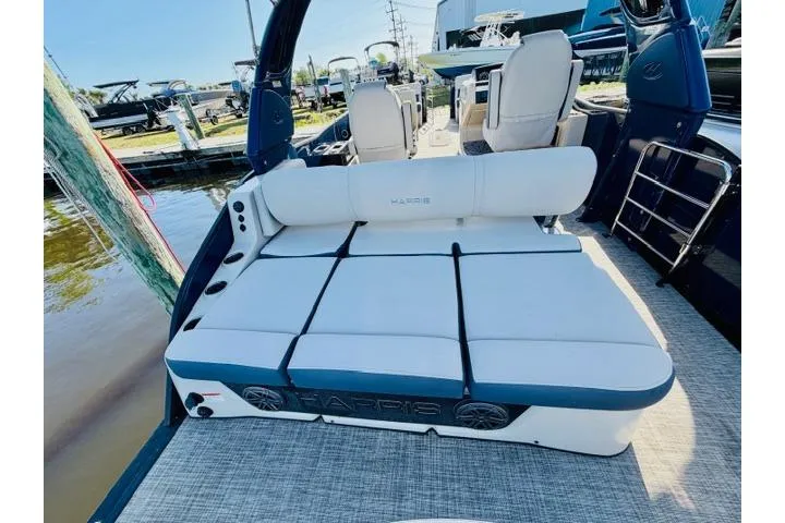 Slide: The Image of 2022 Harris Grand Mariner 250 boat with spacious seating and modern design. - 8