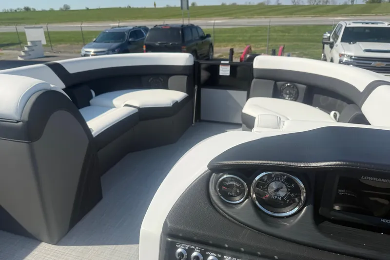Slide: The Image of Interior of 2026 Berkshire CTS Series 24RFX CTS pontoon boat with seating and dashboard. - 11