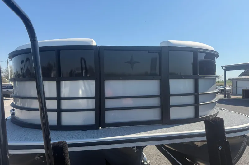 Slide: The Image of 2026 Berkshire CTS Series 24RFX CTS pontoon boat front view under clear blue sky. - 5