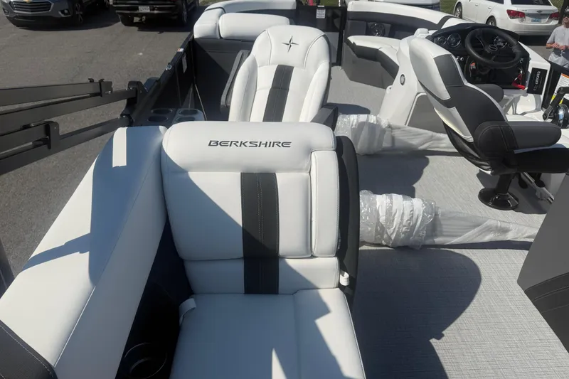 Slide: The Image of 2026 Berkshire CTS Series 24RFX CTS boat interior with white and black seating. - 8