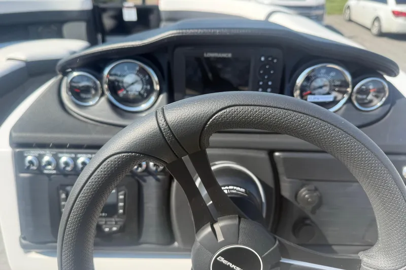 Slide: The Image of Steering wheel and dashboard of 2026 Berkshire CTS Series 24RFX CTS boat. - 9