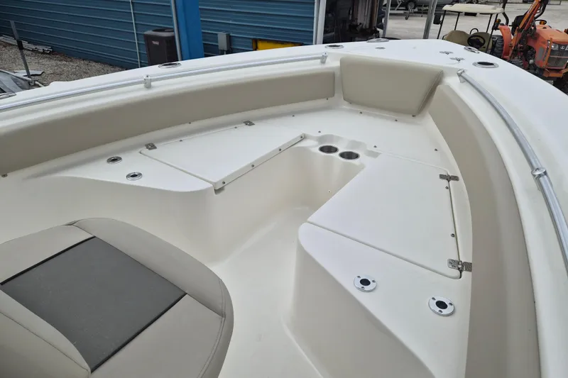 Slide: The Image of 2026 Key West 219 FS boat interior with seating and storage compartments. - 12