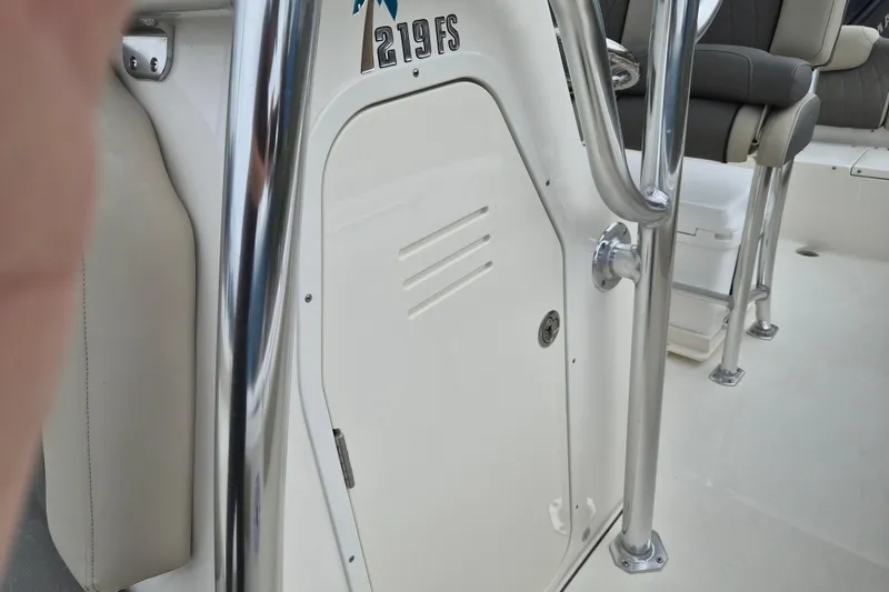 Slide: The Image of 2026 Key West 219 FS boat interior with seating and stainless steel railing. - 15