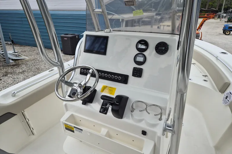 Slide: The Image of 2026 Key West 219 FS boat console with steering wheel and gauges. - 6