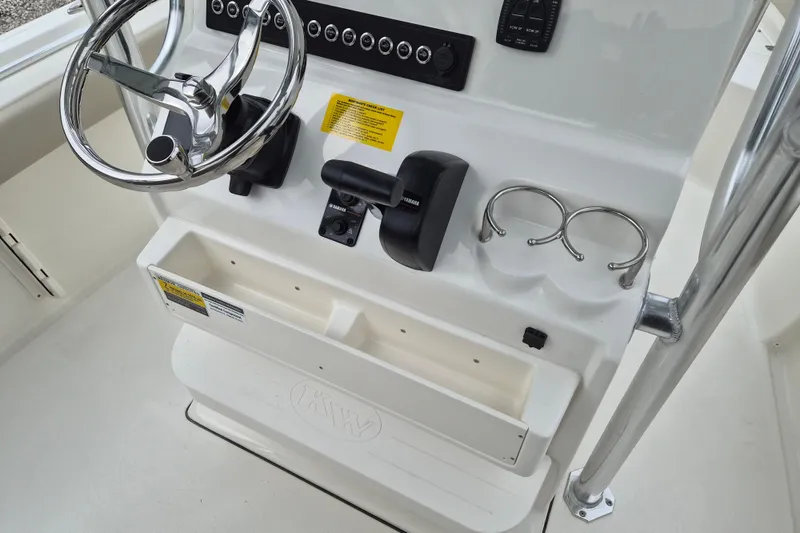 Slide: The Image of 2026 Key West 219 FS boat console with steering wheel and controls. - 7