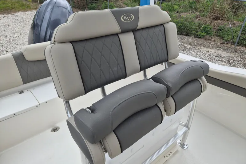 Slide: The Image of 2026 Key West 219 FS boat seating with gray and beige upholstery. - 8