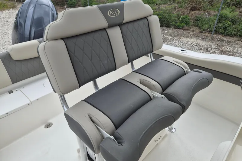 Slide: The Image of 2026 Key West 219 FS boat seating with cushioned backrests and armrests. - 9