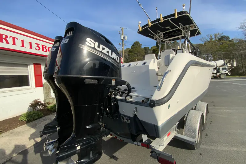 Slide: The Image of 2000 Boston Whaler 26 Outrage boat with Suzuki outboard engines on a trailer. - 10