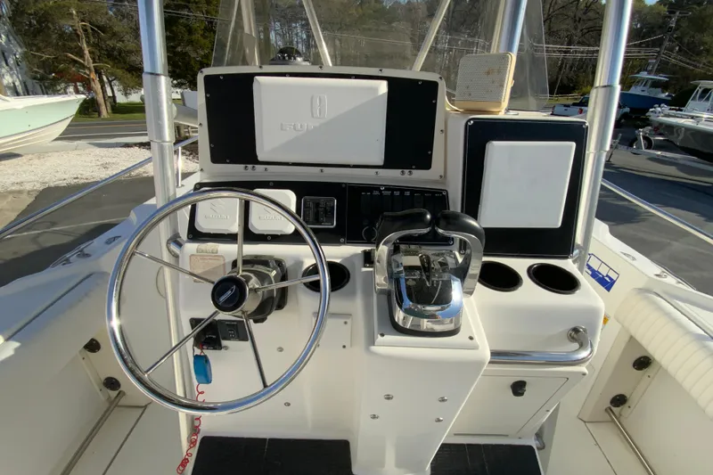 Slide: The Image of Boston Whaler 26 Outrage 2000 boat helm with steering wheel and controls. - 13