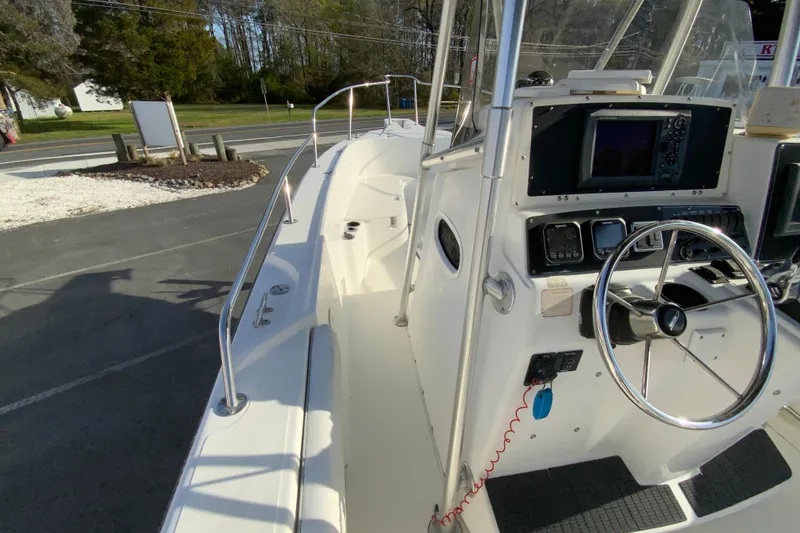 Slide: The Image of 2000 Boston Whaler 26 Outrage boat cockpit with steering wheel and navigation equipment. - 20