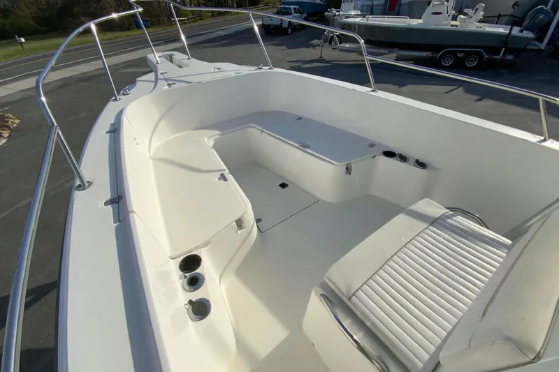Slide: The Image of 2000 Boston Whaler 26 Outrage boat interior with seating and storage compartments. - 21