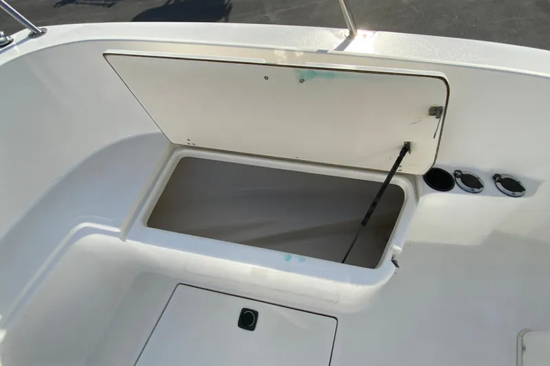 Slide: The Image of Open storage compartment on a 2000 Boston Whaler 26 Outrage boat deck. - 22