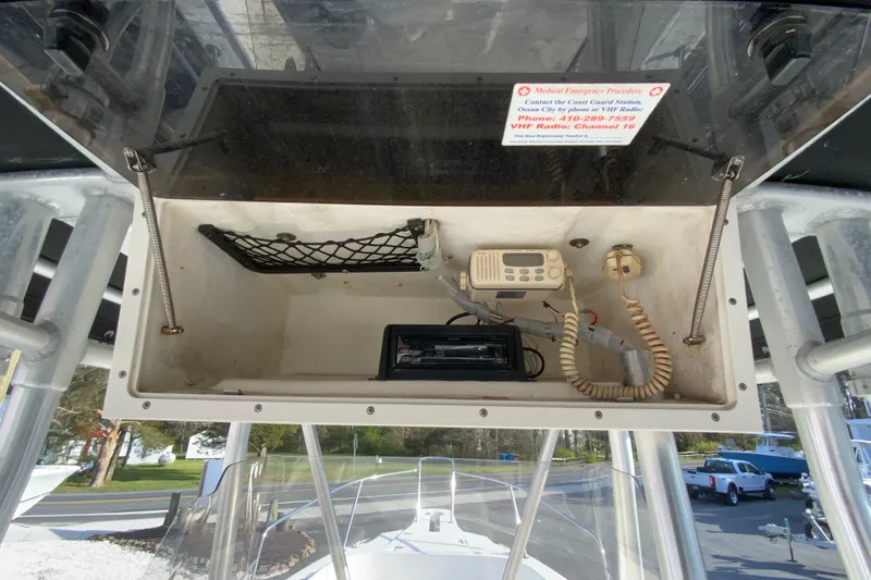 Slide: The Image of Boston Whaler 26 Outrage 2000 model with VHF radio and storage compartment. - 28