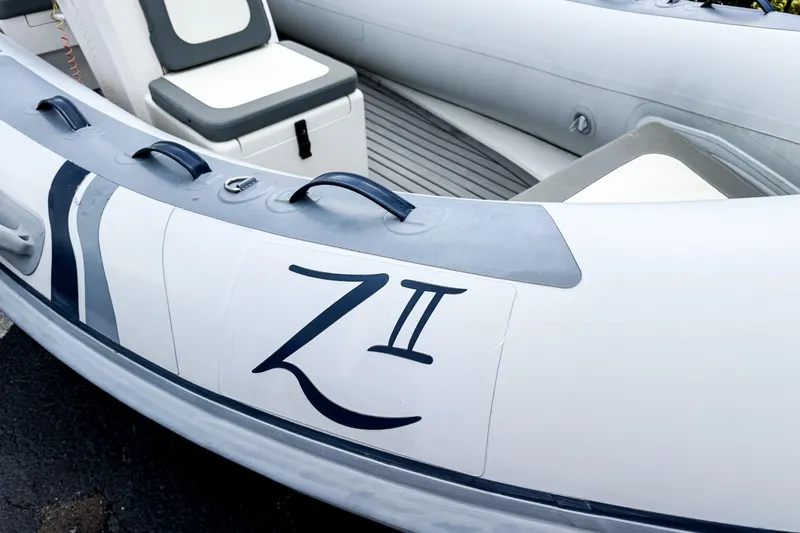 Slide: The Image of 2024 Highfield Classic 420 inflatable boat interior with seating and handles. - 2