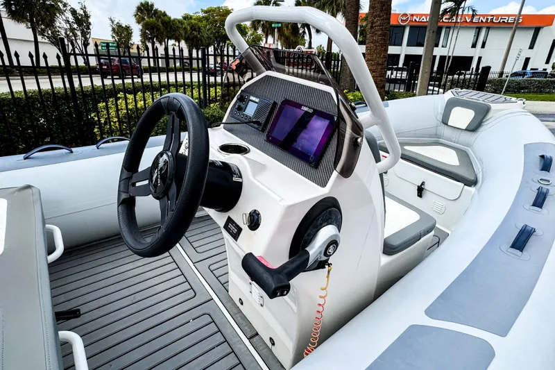 Slide: The Image of 2024 Highfield Classic 420 boat interior with steering wheel and navigation system. - 3