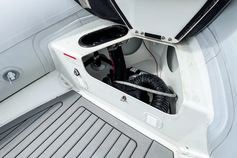 Slide: The Image of Open storage compartment in 2024 Highfield Classic 420 boat, showcasing interior details and components. - 9