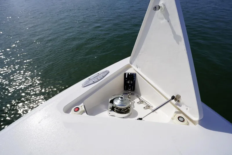 Slide: The Image of Bow of 2003 Intrepid 370 Cuddy boat with anchor compartment open. - 18