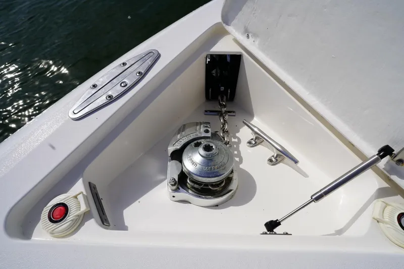 Slide: The Image of Anchor compartment of 2003 Intrepid 370 Cuddy boat with winch and cleat. - 19