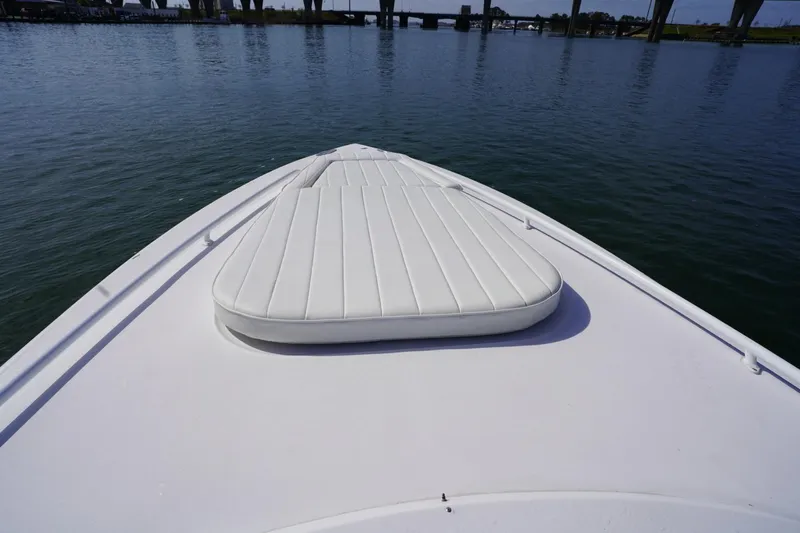 Slide: The Image of Bow view of 2003 Intrepid 370 Cuddy boat on calm water. - 20