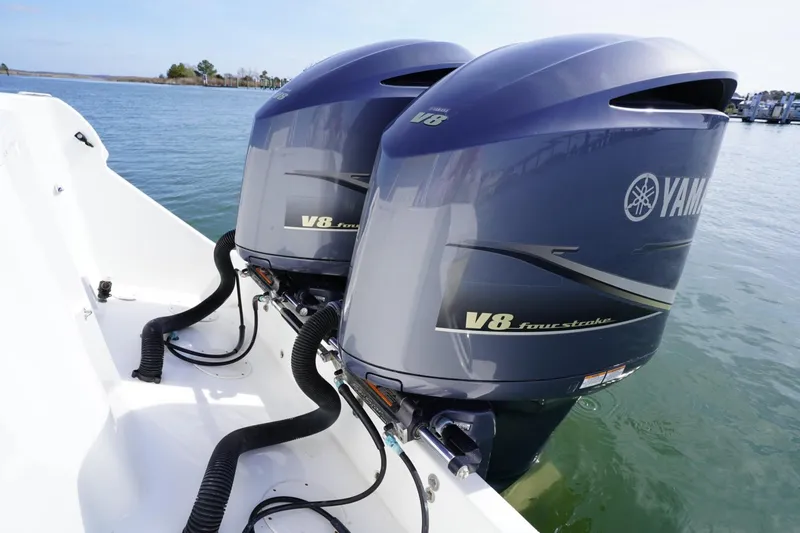 Slide: The Image of Twin Yamaha V8 outboard engines on a 2003 Intrepid 370 Cuddy boat. - 32