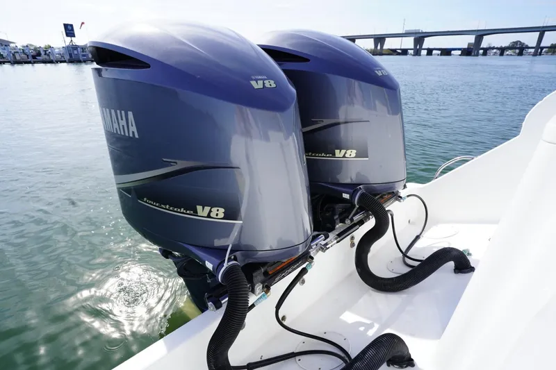 Slide: The Image of Twin Yamaha V8 outboard engines on a 2003 Intrepid 370 Cuddy boat, dockside view. - 33