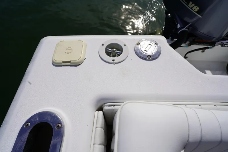 Slide: The Image of 2003 Intrepid 370 Cuddy boat deck with water access and seating. - 34