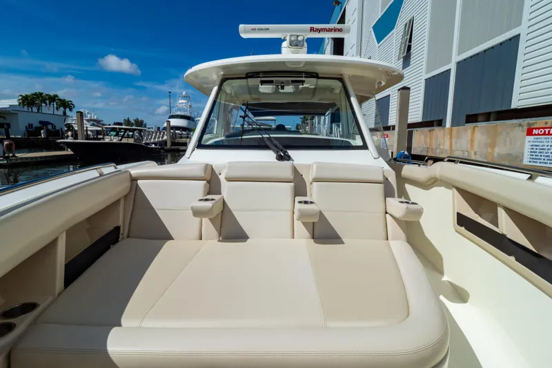 Slide: The Image of 2019 Boston Whaler 350 Realm boat interior with beige seating and modern design. - 104