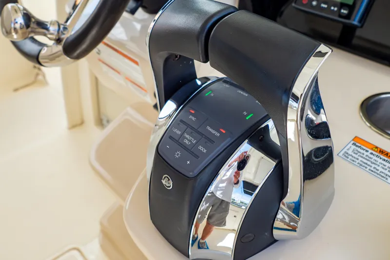 Slide: The Image of Control panel of a 2019 Boston Whaler 350 Realm boat, featuring sleek design elements. - 12