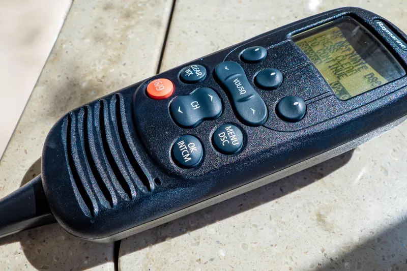 Slide: The Image of Close-up of a marine radio handset on a Boston Whaler 350 Realm, 2019 model. - 13