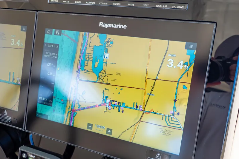 Slide: The Image of Raymarine navigation display on 2019 Boston Whaler 350 Realm, showing depth and map details. - 15